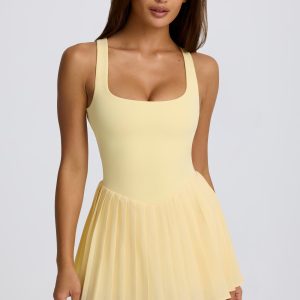 Soft Active Open-Back Pleated Tennis Dress in Lemon