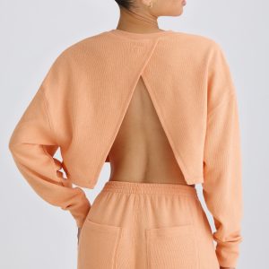 Textured Cotton Jersey Open-Back Cropped Sweatshirt in Peach