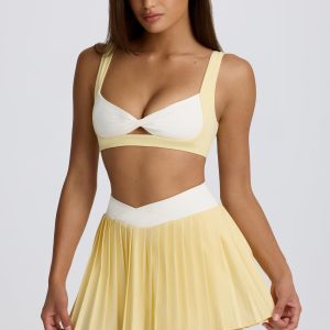 Soft Active Crossover Pleated Mini Skort in Lemon
